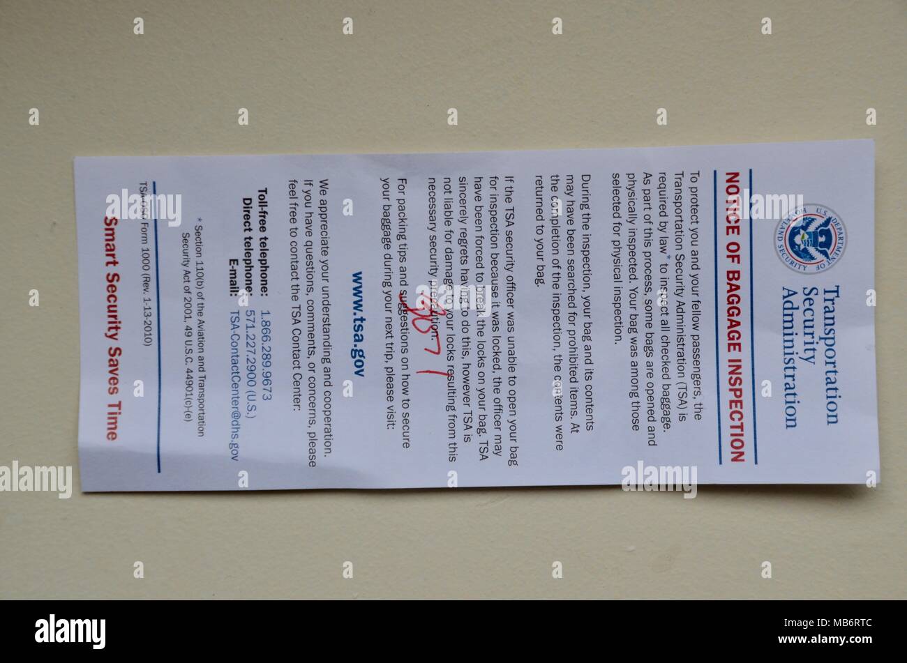 an english language card for the USA notice of baggage inspection TSA Stock Photo