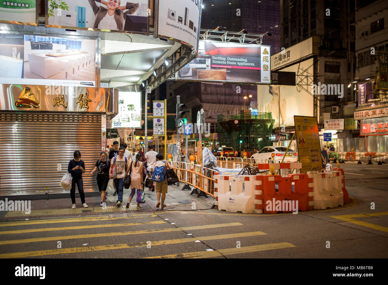 Streets of Hong Kong in Kowloon, at night Stock Photo - Alamy