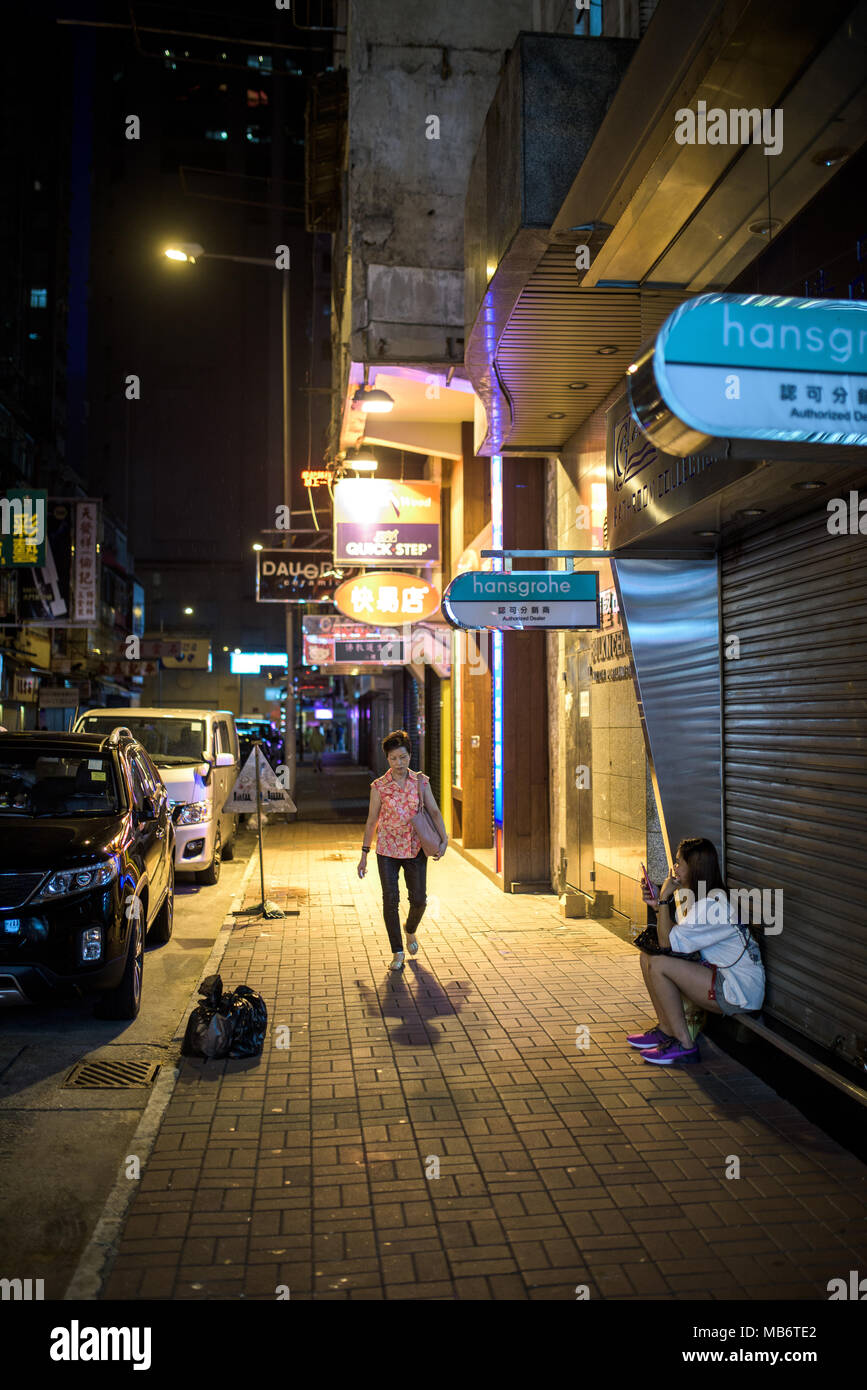 Streets of Hong Kong in Kowloon, at night Stock Photo - Alamy