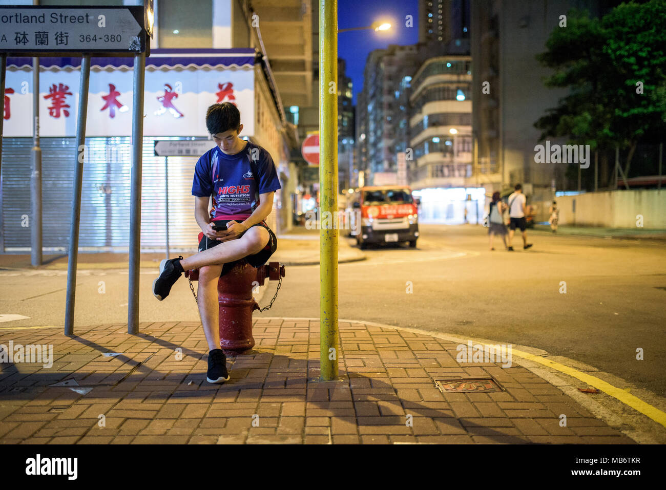 Streets of Hong Kong in Kowloon, at night Stock Photo - Alamy