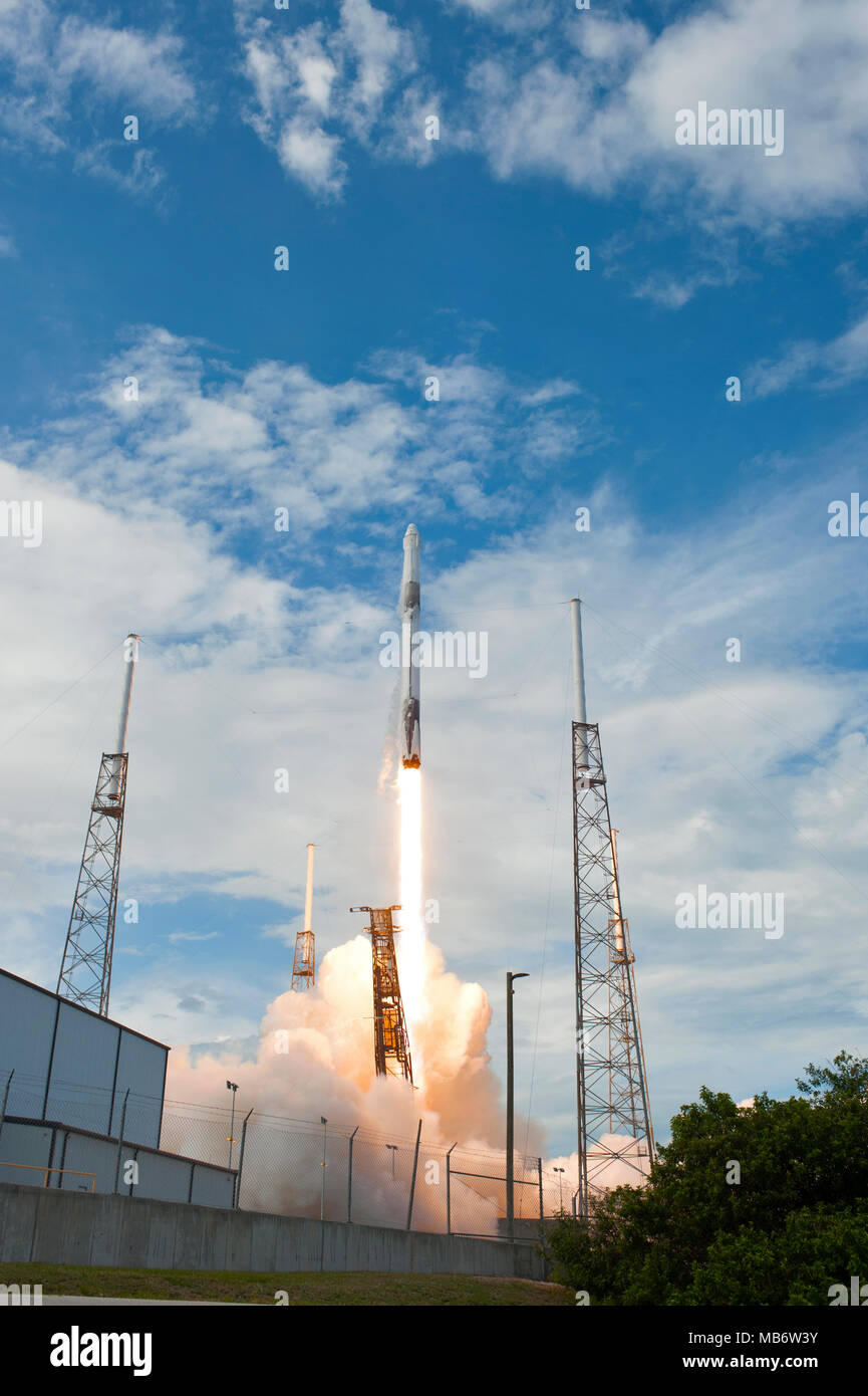 A SpaceX Falcon 9 rocket carrying the Dragon resupply spacecraft blasts ...
