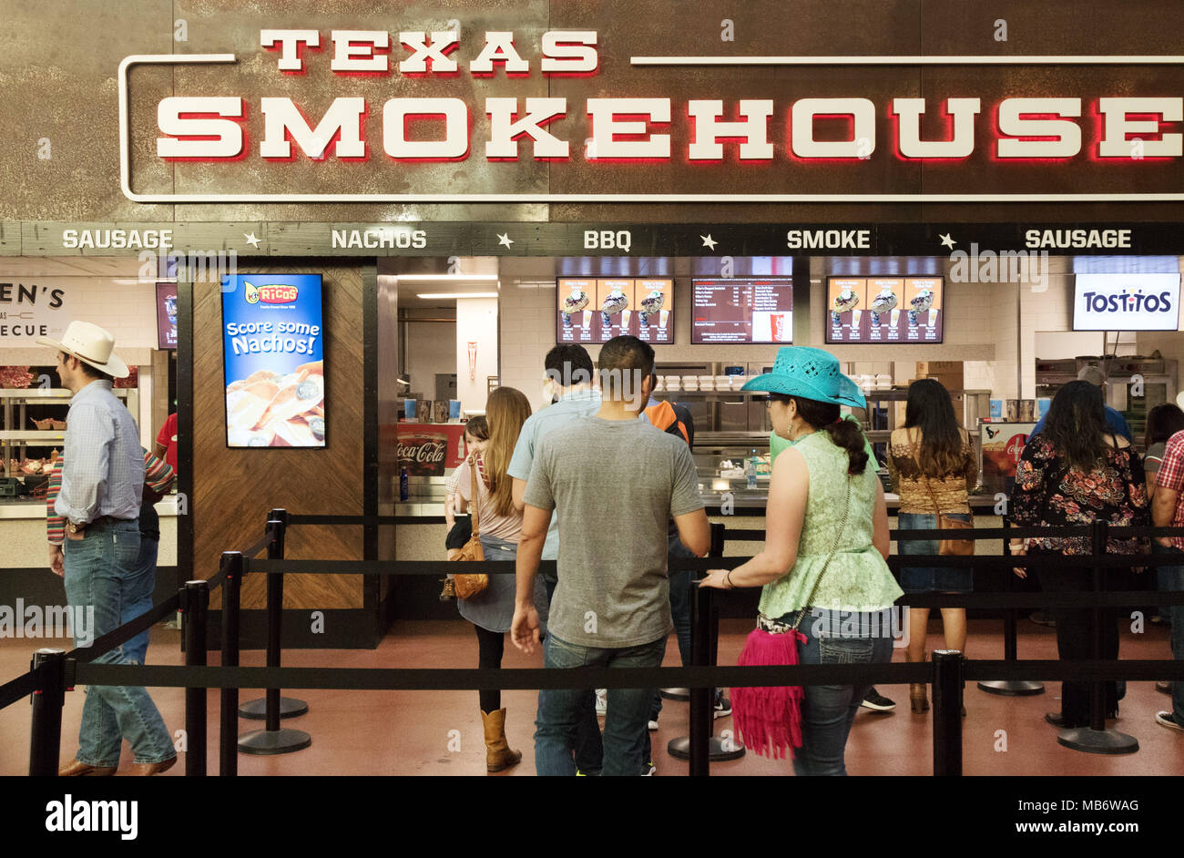 People buying fast food at Texas Smokehouse BBQ fast food at the NRG Stadium, Houston, Texas USA Stock Photo