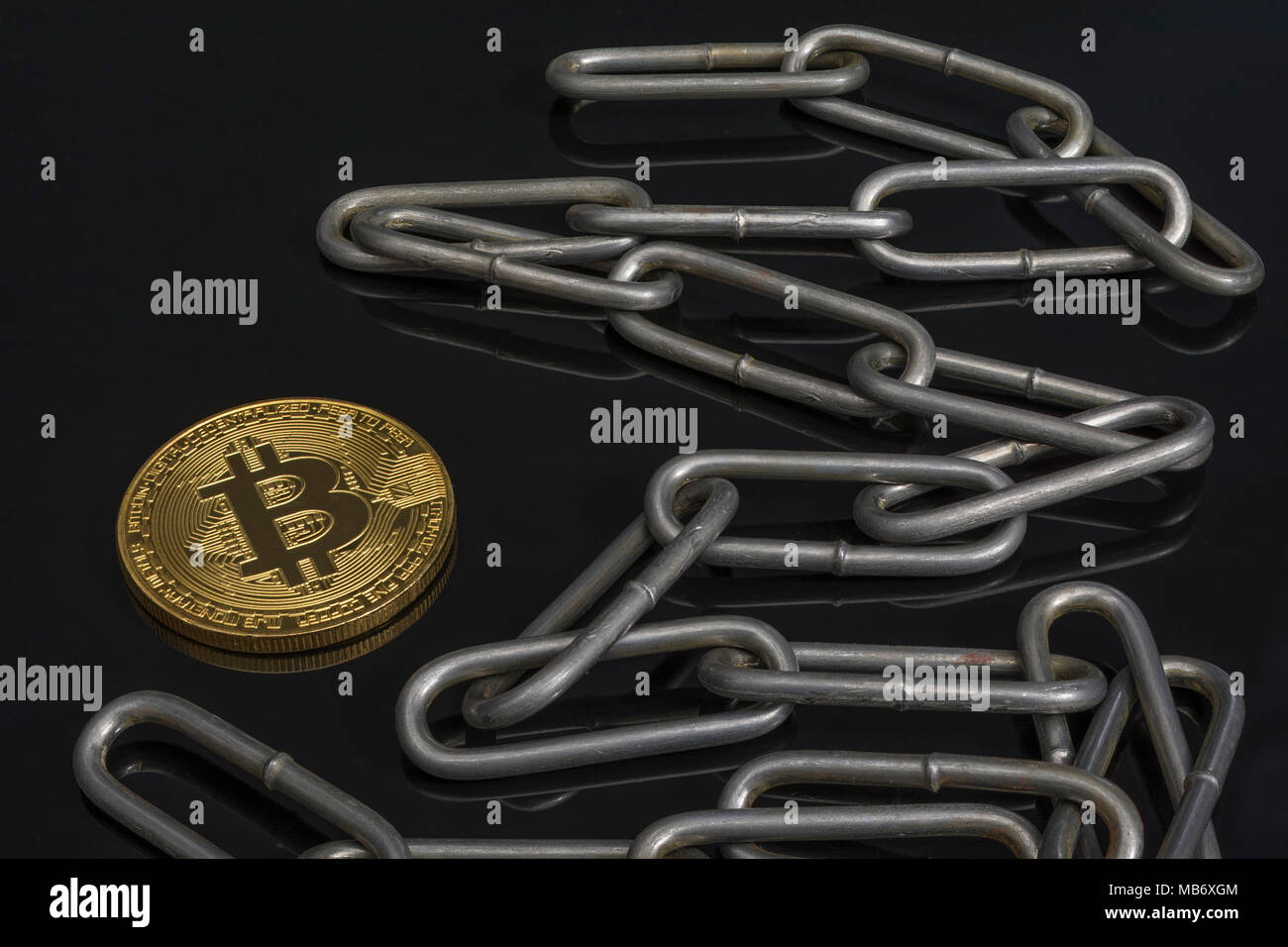 Metal chains with gold Bitcoin - for cryptocurrency blockchain concept & Bitcoil price crash. China Blockchain conference metaphor, bitcoin crypto. Stock Photo