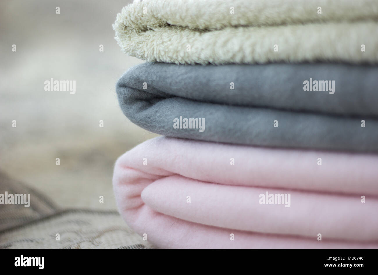 Pink and gray plaid with folded towel close-up Stock Photo