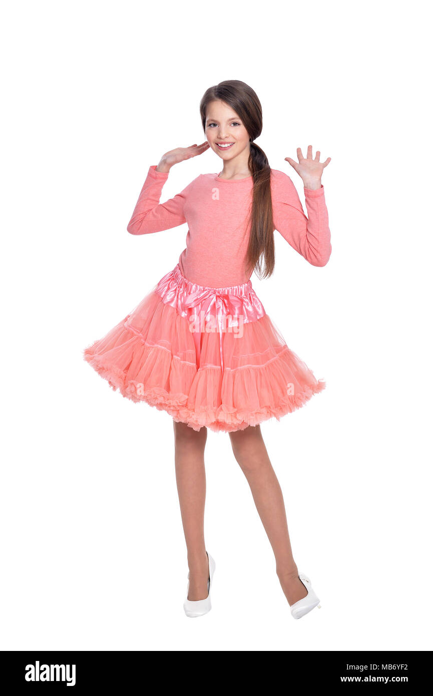 Happy little girl in pink dress posing isolated Stock Photo - Alamy