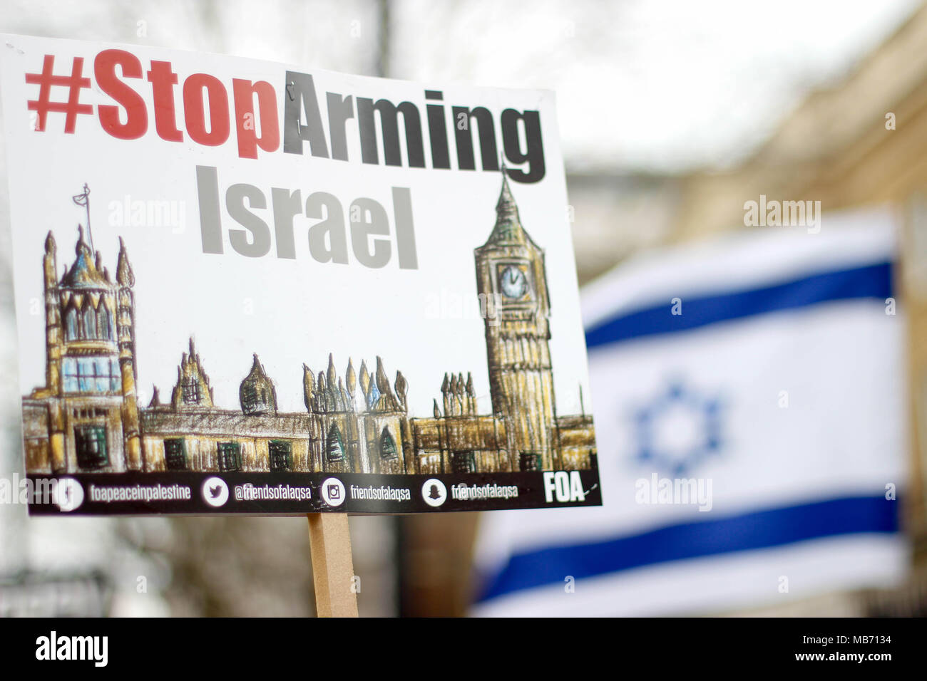 Protest sign against Israel and Israeli Flag Stock Photo