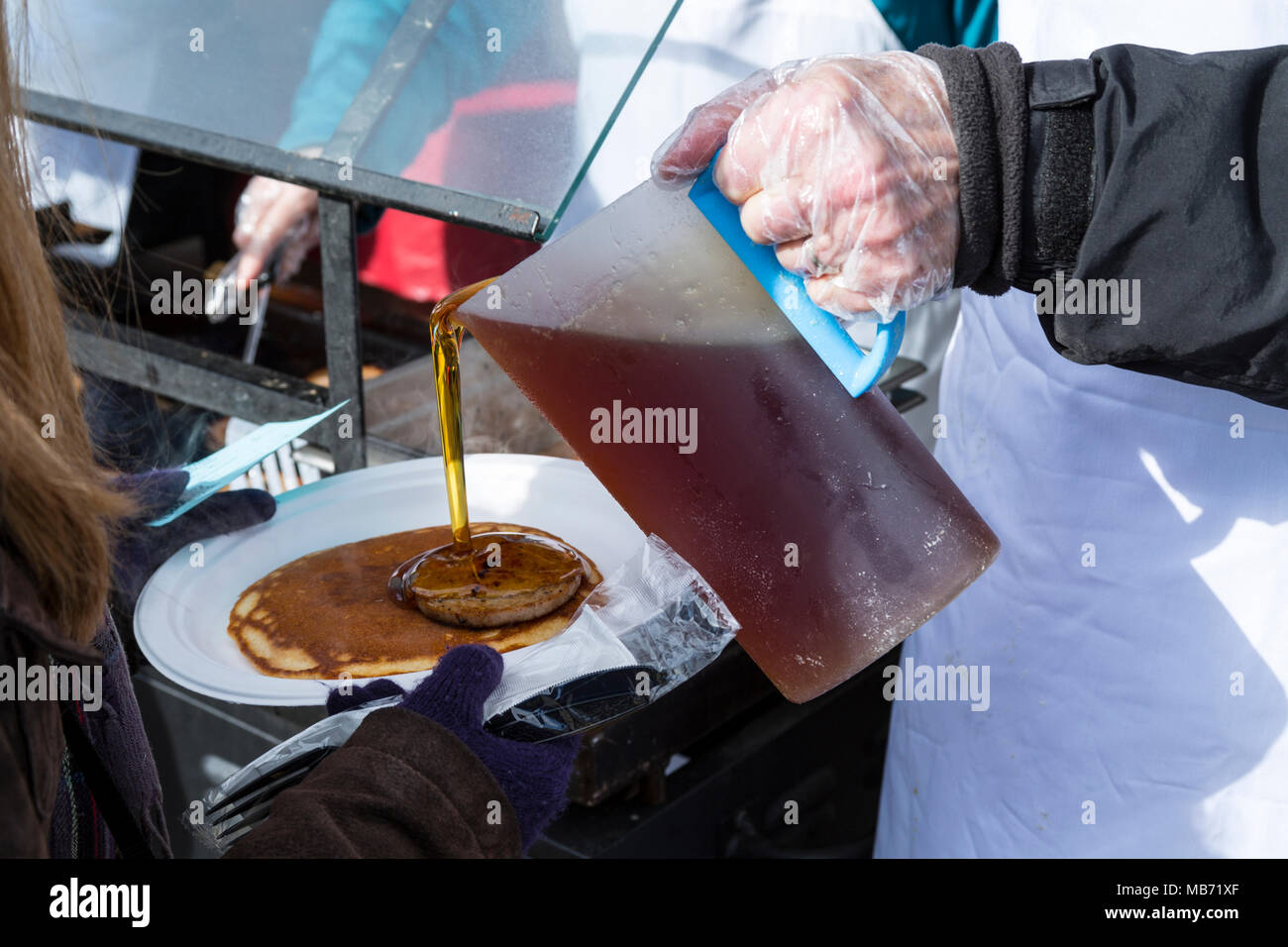 Elmira, Ontario Canada. 07 April 2018. Elmira Maple Syrup Festival 2018, World's largest single day syrup festival. Serving pancakes with maple syrup. Performance Image/Alamy Live News Stock Photo