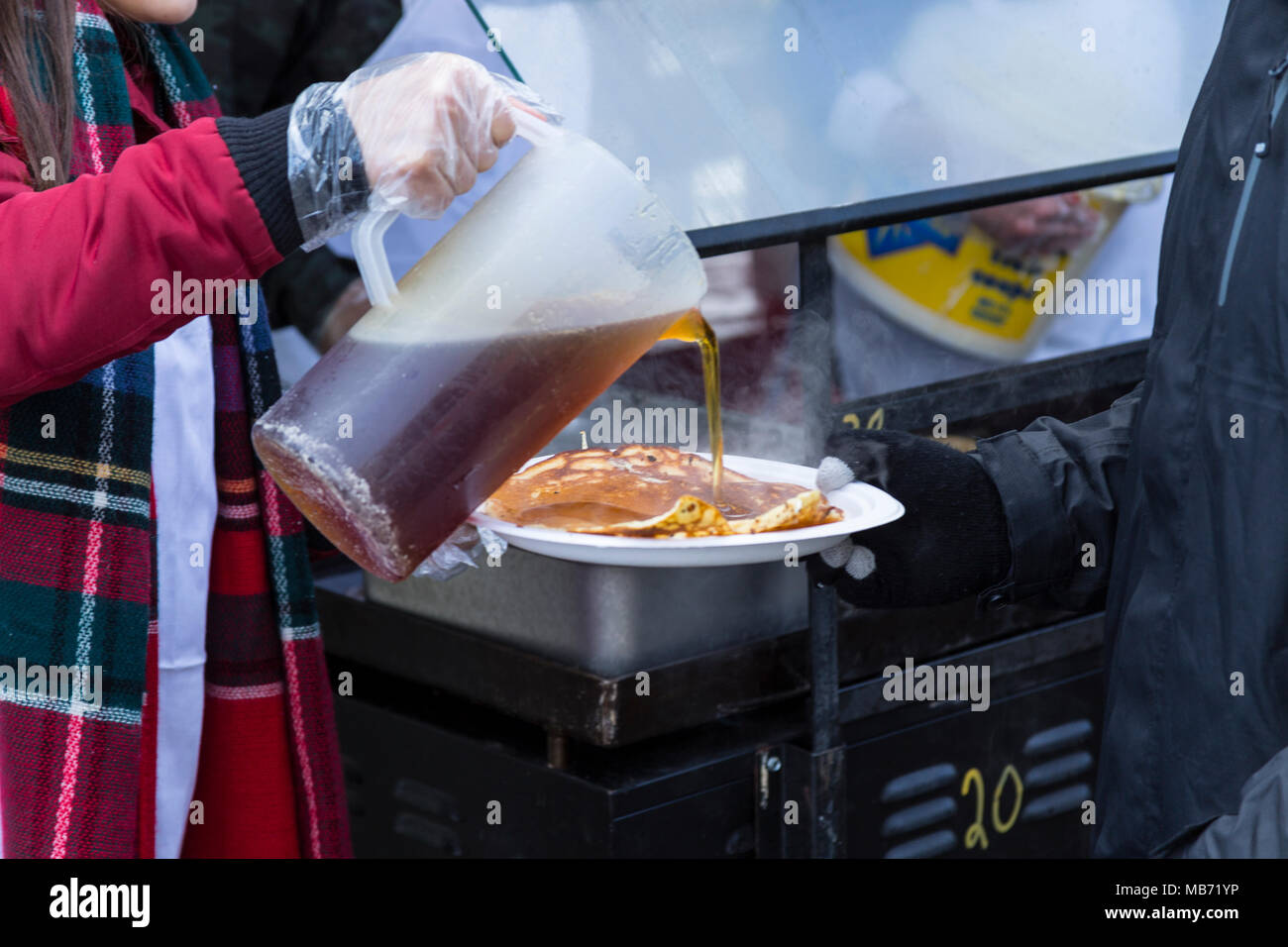 Elmira, Ontario Canada. 07 April 2018. Elmira Maple Syrup Festival 2018, World's largest single day syrup festival. Serving pancakes with maple syrup. Performance Image/Alamy Live News Stock Photo