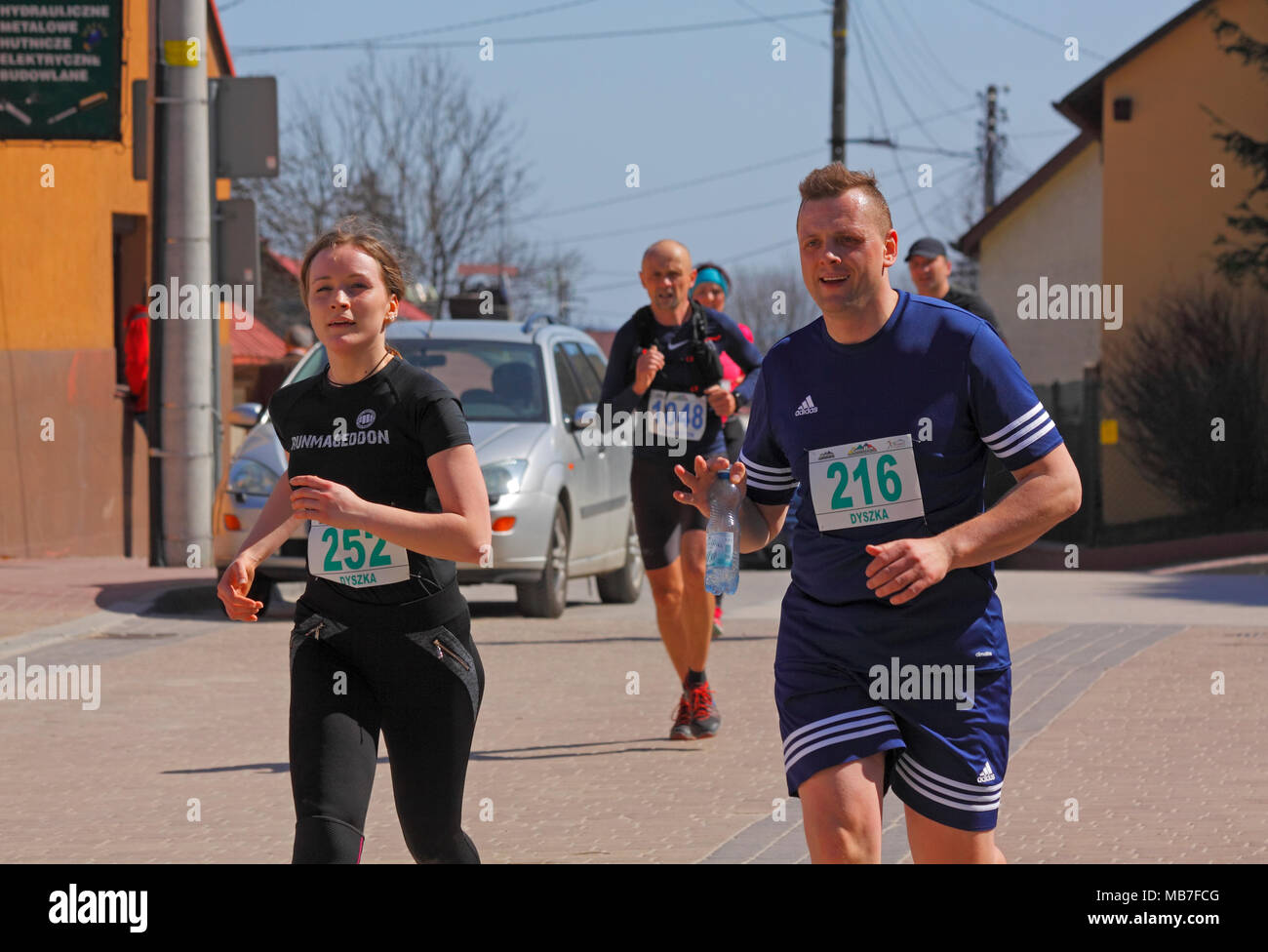 Checiny, Poland, 7th April, 2018. Runners on a street. CROSSRUN ...