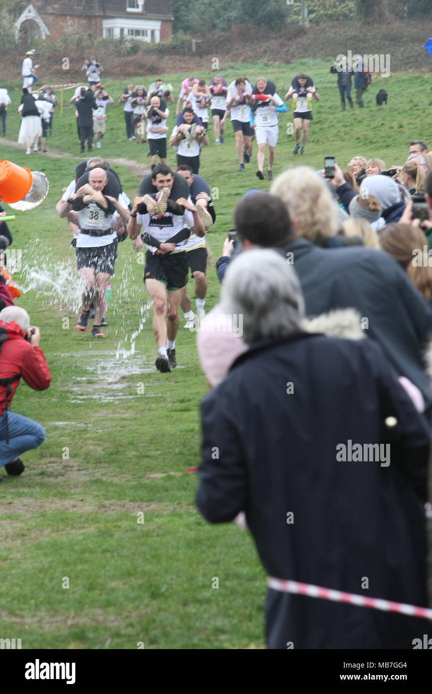 Dorking Surrey Uk April 8th 18 Images From The 11th Edition Of The Annual Uk Wife Carrying Competition On The Nower Dorking Surrey Competitors Run Down The Hill Into The Water Zone