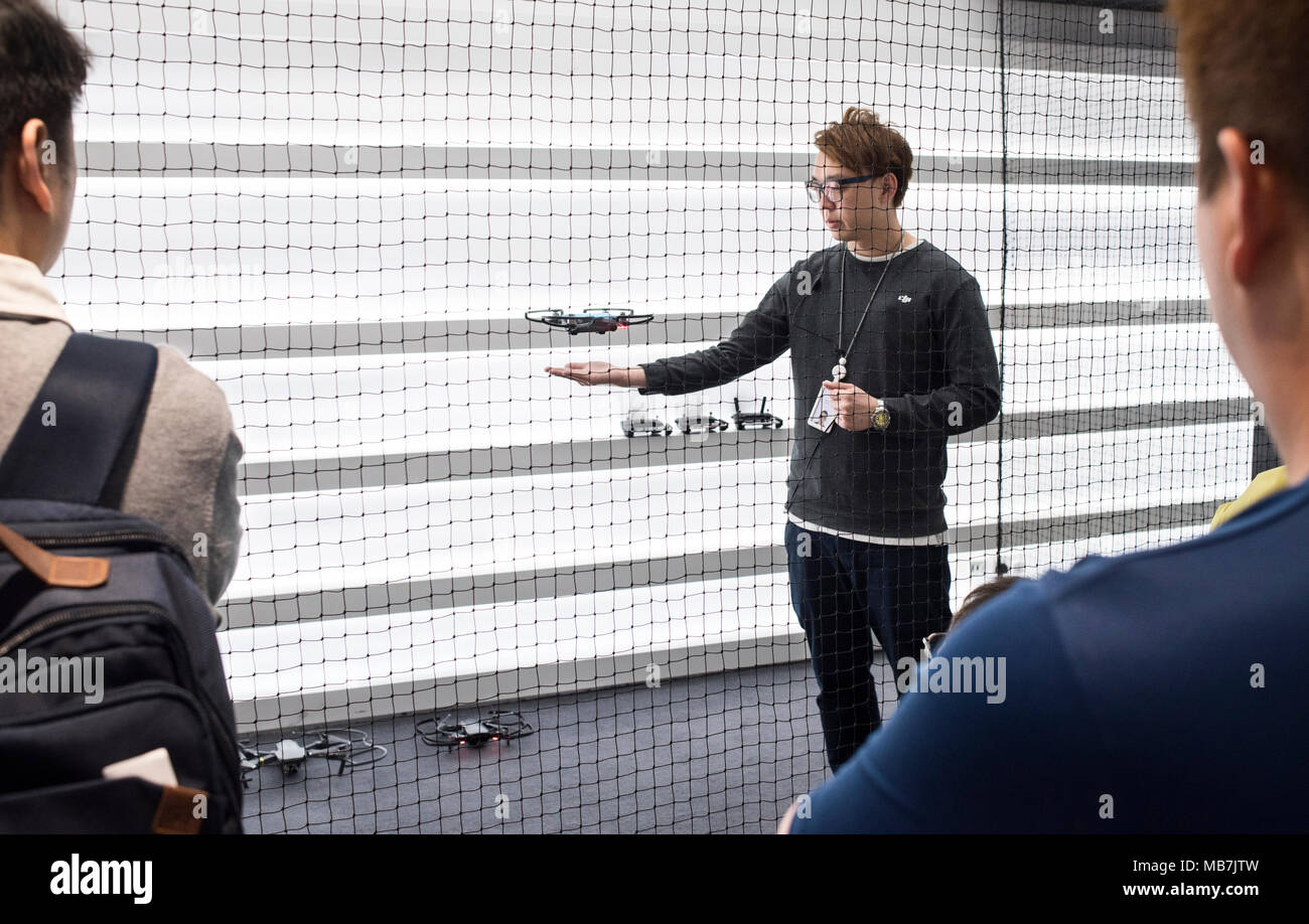 An employee from Chinese technology company DJI demonstrates gesture  control feature on the Spark drone at DJI flying area official store in  Hong Kong Stock Photo - Alamy