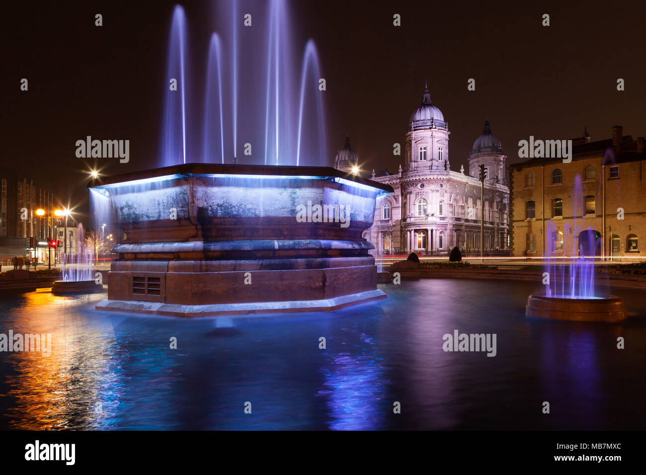 Hull, UK. 7th April, 2018. UK News: Hull's Maritime Museum and Queens Gardens Fountain, illuminated as part of the City's new 'Golden Hour' lighting installation, designed by artist Nayan Kulkarni. Hull, UK City of Culture 2017, East Yorkshire, UK. 7th April 2018. Credit: LEE BEEL/Alamy Live News Stock Photo