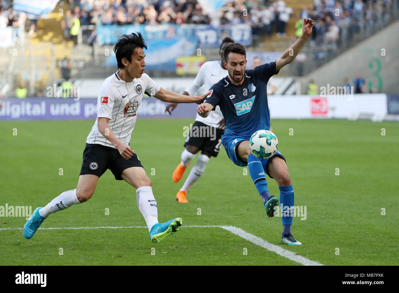 Frankfurt. 8th Apr, 2018. Makoto Hasebe (L) of Frankfurt vies with Lukas Rupp of Hoffenheim during the Bundesliga match between Eintracht Frankfurt and TSG 1899 Hoffenheim in Frankfurt Germany, April 8, 2018. The match ended with 1-1. Credit: Ulrich Hufnagel/Xinhua/Alamy Live News Stock Photo