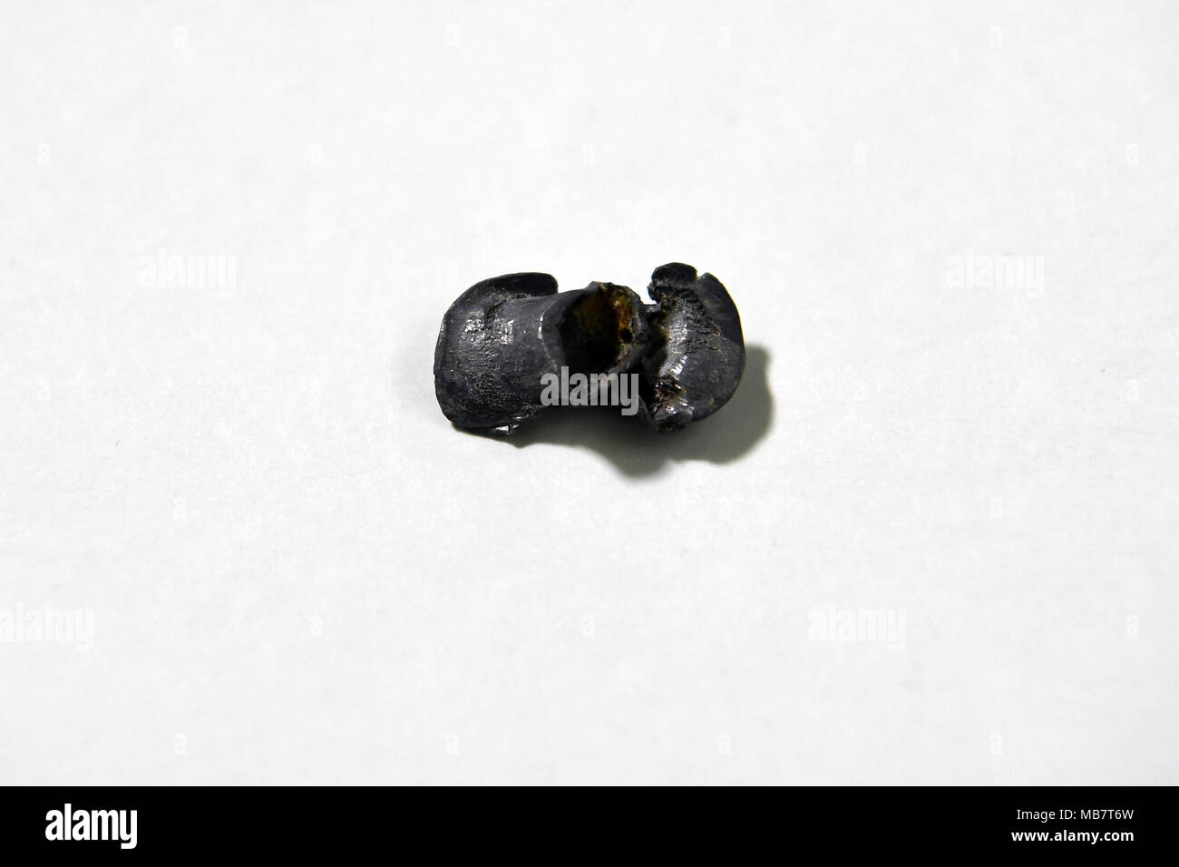 06 April 2018, Germany, Berlin: A bullet from the assasination of Rudi Dutschke is being shown in the police history collection. This bullet was removed from the head of Rudi Dutschke. The exhibition 'Drei Kugeln auf Rudi Dutschke' (lit. three bullets at Rudi Dutschke) from the Berlin police and about the assasination 50 years ago of the student leader. The exhibition will open on 09 April 2018 and will run until the 20 July 2018. Photo: Britta Pedersen/dpa-Zentralbild/dpa Stock Photo