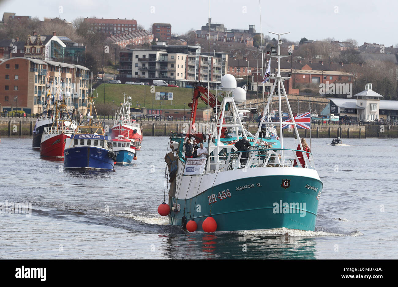 A flotilla of fishing boats by the Gateshead Millennium Bridge in Newcastle, in a protest, organised by Campaign for an Independent Britain and Fishing for Leave, against the deal that will see the UK obeying the EU Common Fisheries Policy for the transition period of Brexit. Stock Photo
