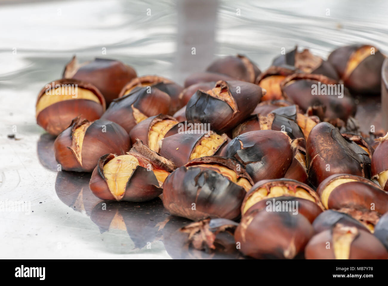Roasted chestnuts for sale on the streets in autumn and winter season.  Castanea sativa Stock Photo - Alamy