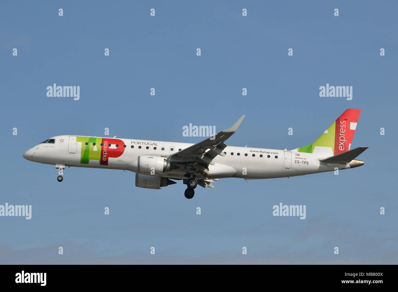 TAP Express Embraer 190 aircraft on approach to London City Airport Stock Photo