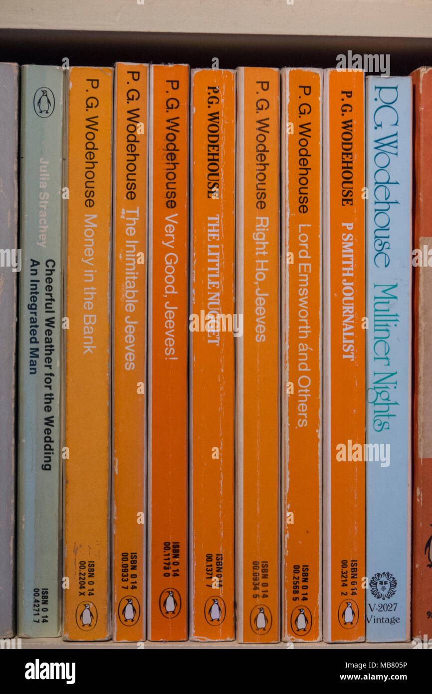 A collection of P.G. Wodehouse books in a home library Stock Photo