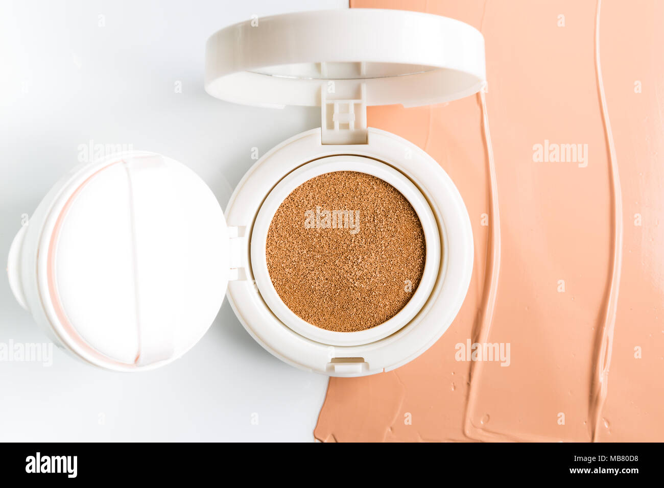 Foundation cushion with sponge and puff on white background Stock Photo