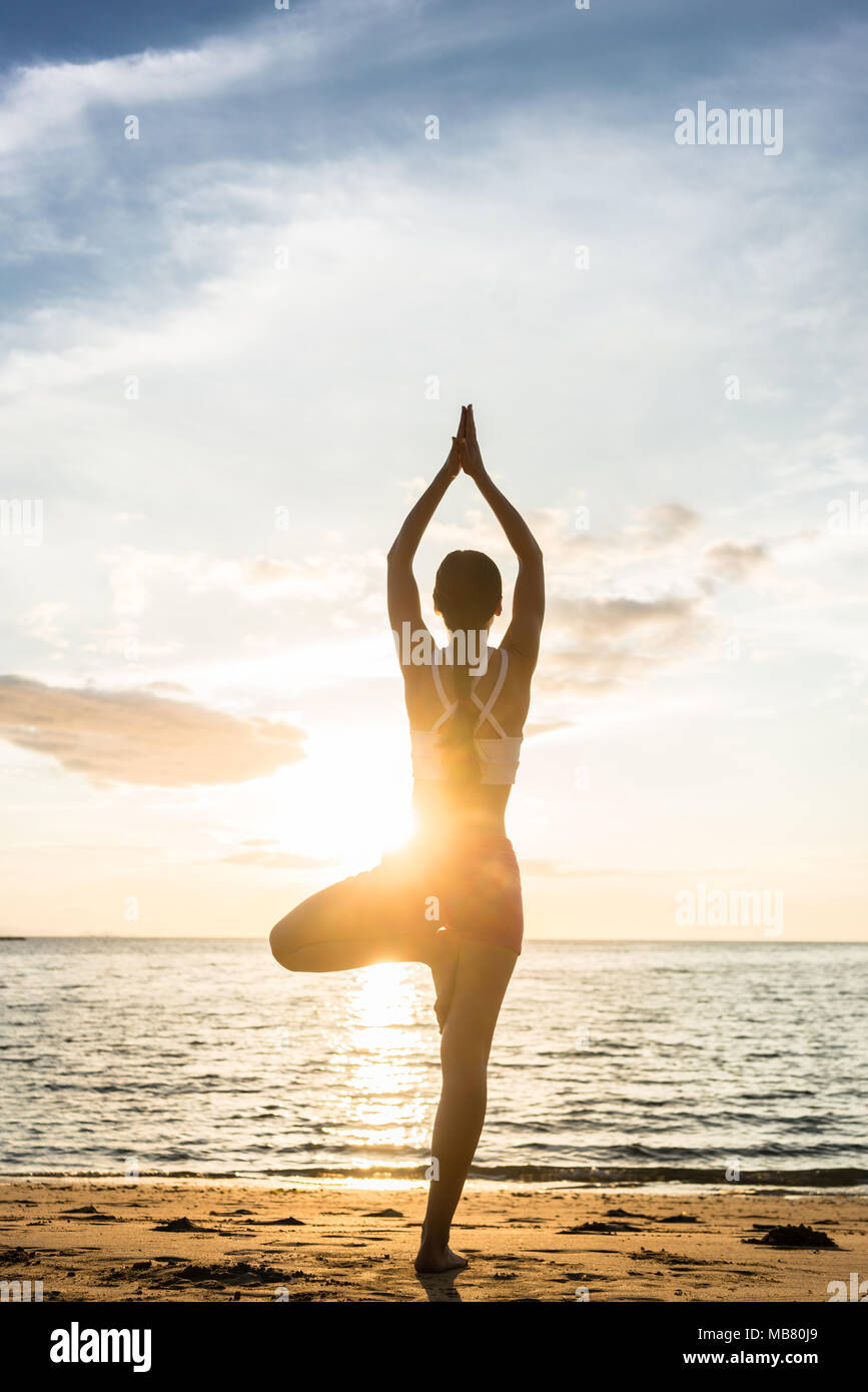 Silhouette of yoga tree pose hi-res stock photography and images - Alamy