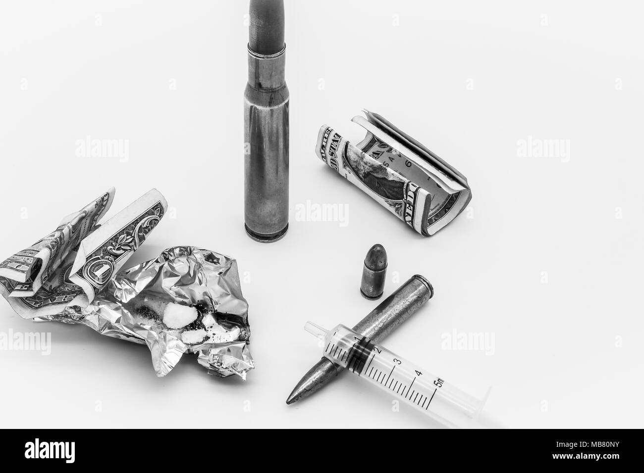 Mockup concept of illegal drug dealing on a work surface. The view shows docup on various