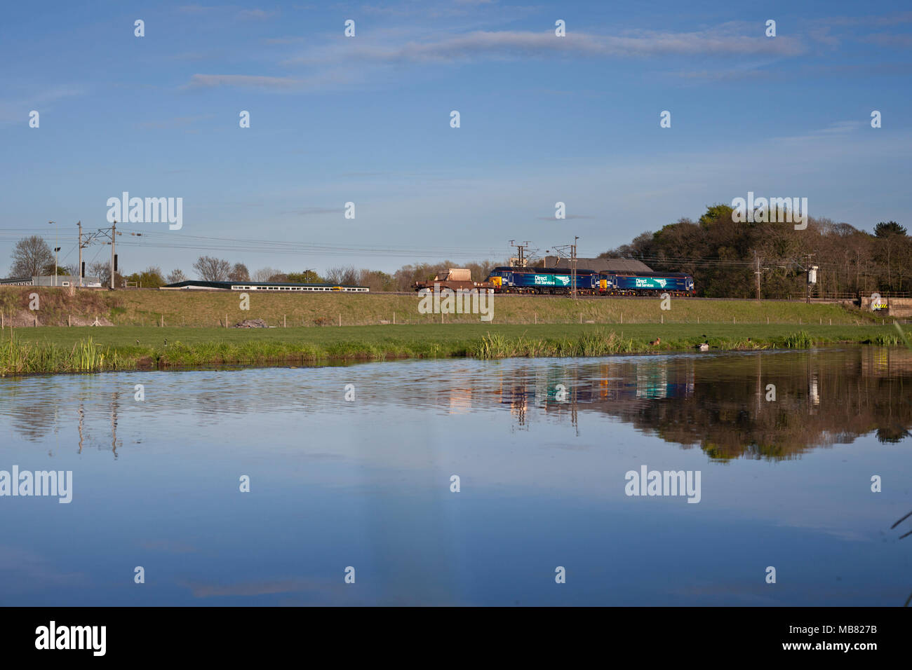 2 Direct rail Services class 57 locomotives on the west coast main line alongside a canal with the a nuclear flask Stock Photo