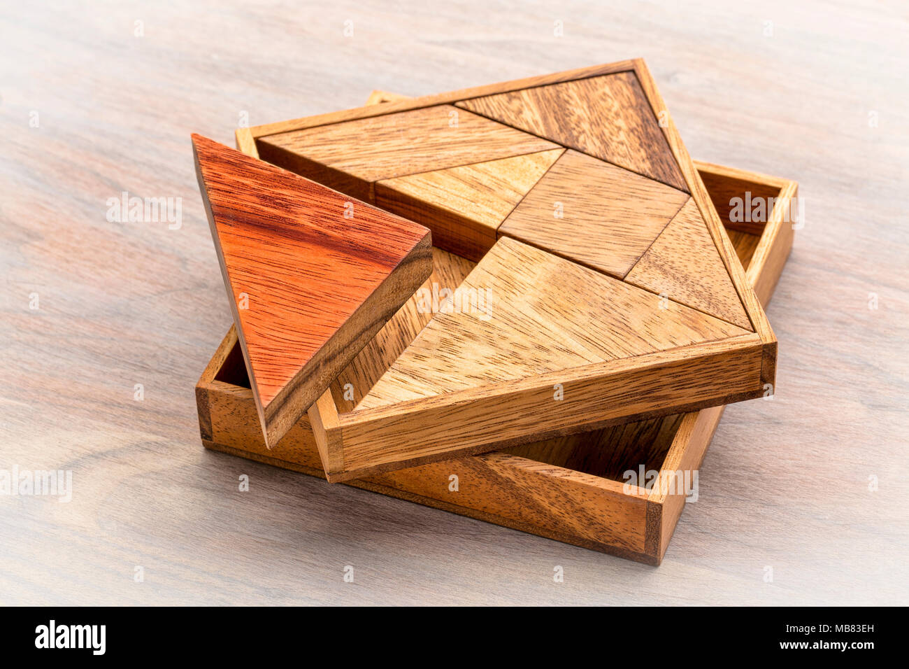 Tangram, a traditional Chinese Puzzle Game made of different wood parts to  build abstract figures from them Stock Photo - Alamy