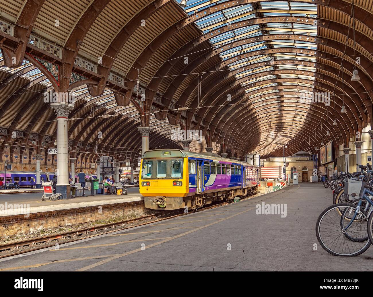Platform 1 of York Station where a train waits to depart. The ornate