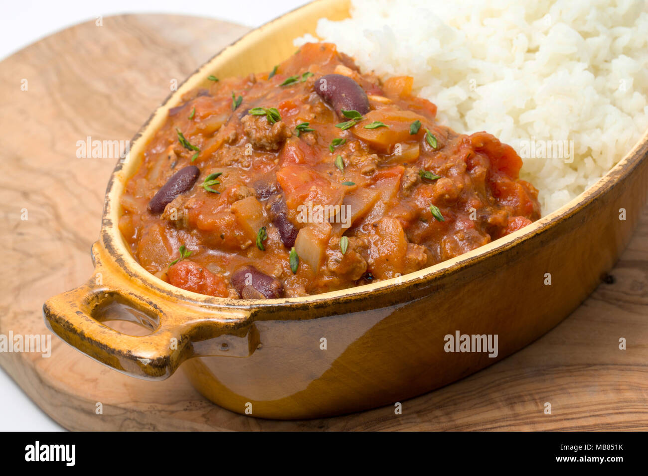 Chili con carne made from minced venison from a roe deer, Capreolus capreolus, kidney beans, tomatoes, onions, spices and sprinkled with fresh thyme.  Stock Photo