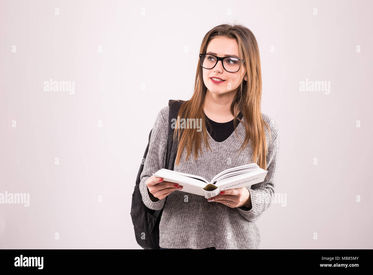 Portrait of a cheerful smiling african student girl wearing backpack ...