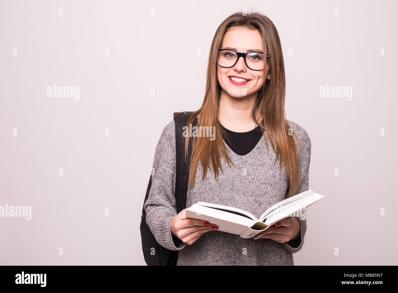 Portrait of a cheerful smiling african student girl wearing backpack ...