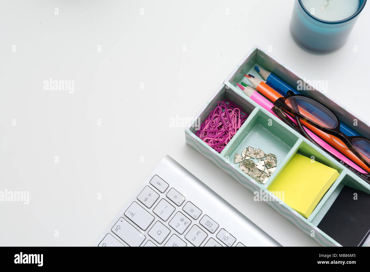 Top view of creative work space on white desk Stock Photo