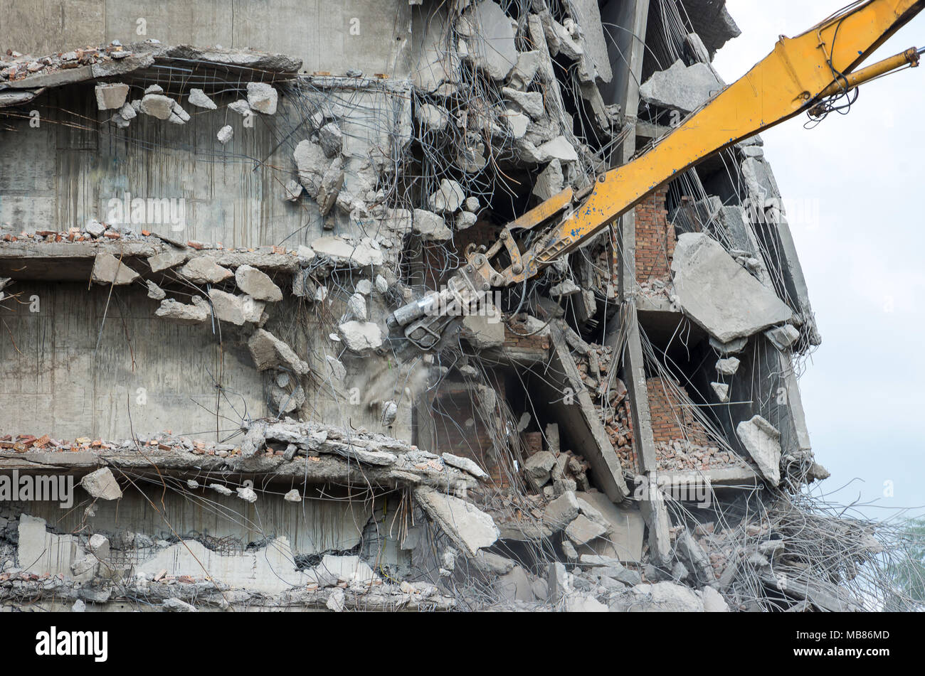 Building demolition with hydraulic excavator Stock Photo Alamy