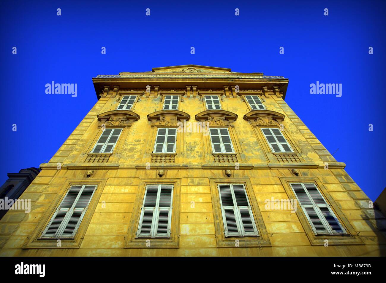 Yellow building on blue sky background Stock Photo