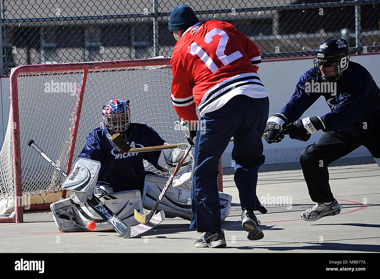 Team USA goalie makes a save against Team Canada during the USA Jr Airman vs Canada Jr. Airmen Ball Hockey Tournament at the Peterson Roller Hockey Rink at Peterson AFB February 21, 2014. Canada won the game 6-0. Stock Photo