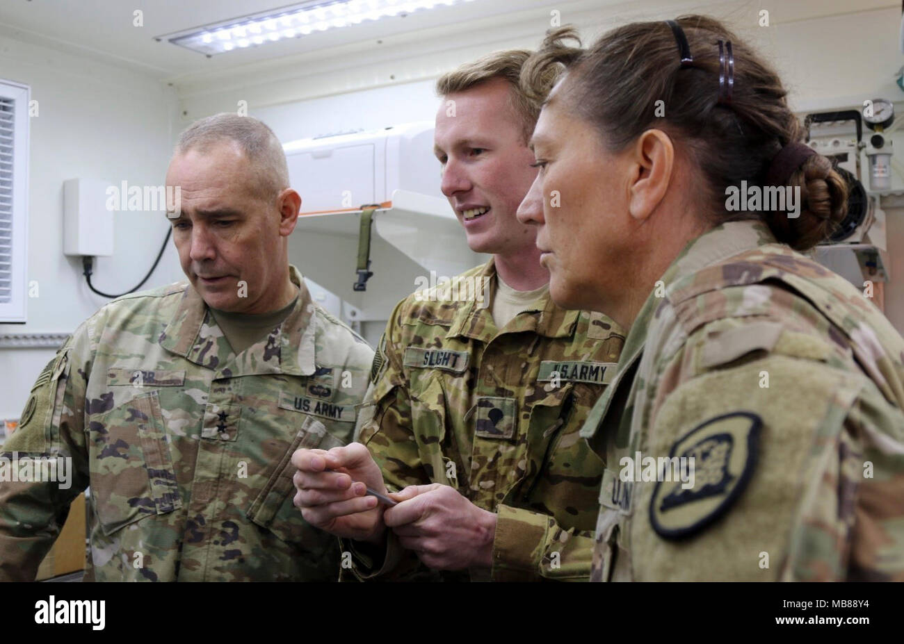 CAMP BUEHRING, Kuwait Spc. Levi Slight (center), a petroleum