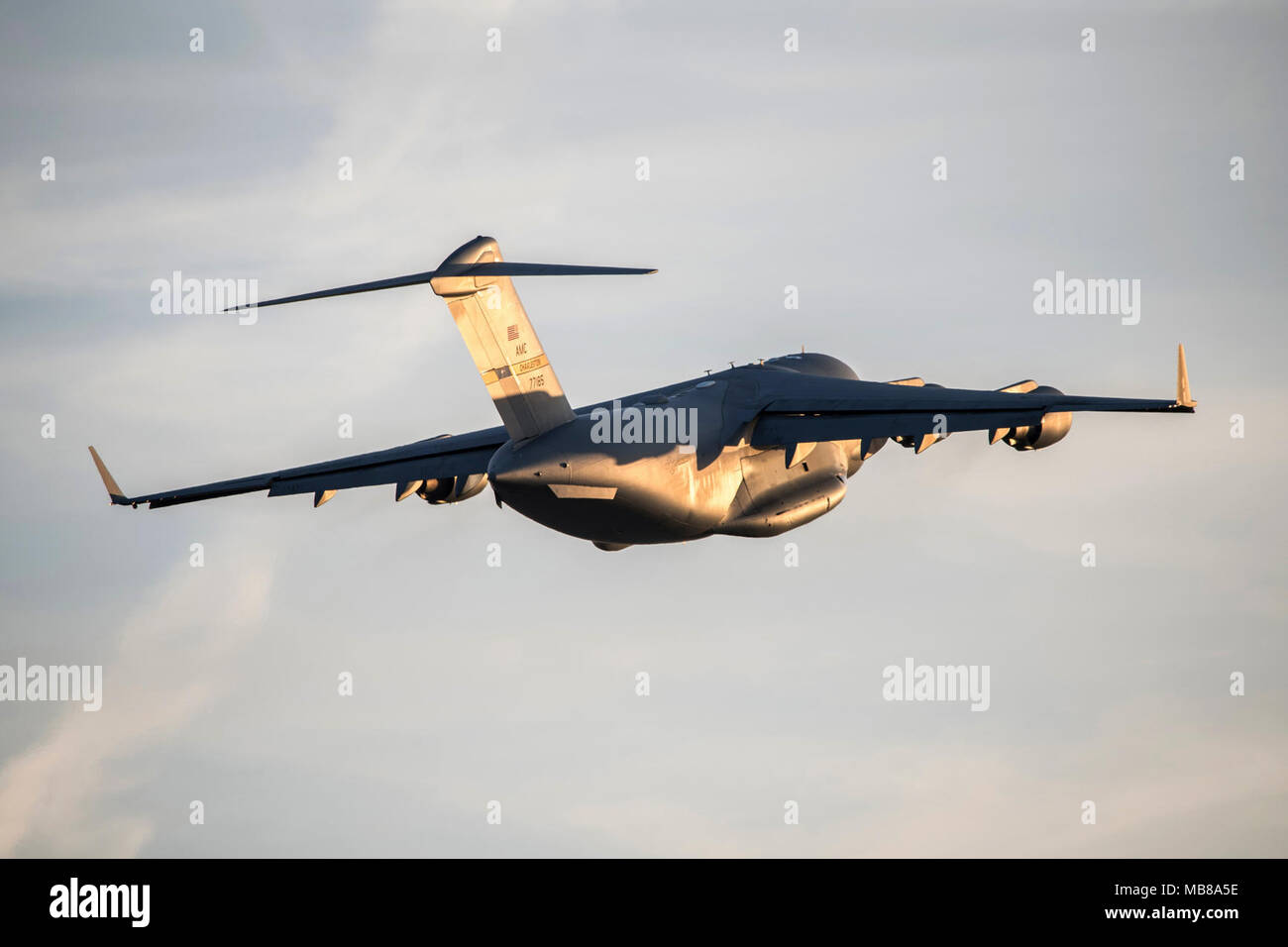 POPE ARMY AIRFIELD, N.C. — A C-17 Globemaster III from the 437th Airlift Wing at Joint Base Charleston, S.C., launches at dusk with a load of 82nd Airborne Division paratroopers and cargo Feb. 9, 2018, during a joint Large Package Week and Emergency Deployment Readiness Exercise held Feb. 5-11. Airmen in the 43d Air Mobility Operations Group at Pope provided ground support for visiting Air Force aircrews airlifting Soldiers and equipment out of Pope Field during the exercise. Throughout the week, Air Mobility Command crews carried out 173 missions, transporting more than 3,000 paratroopers and Stock Photo