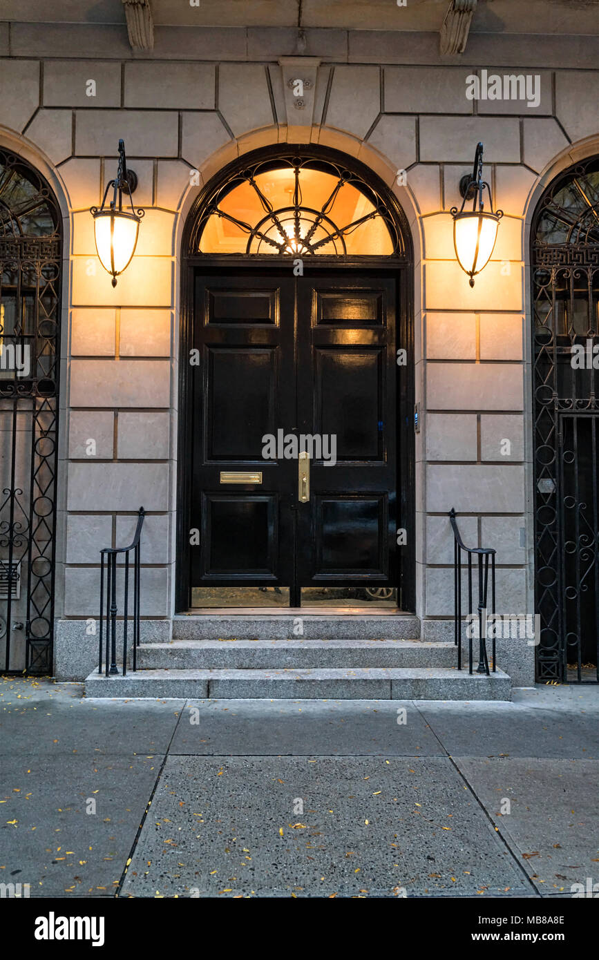 New York City, Manhattan, Upper East Side.  Close Up of a a Mansion Entrance at Twilight.  Lights On. Stock Photo