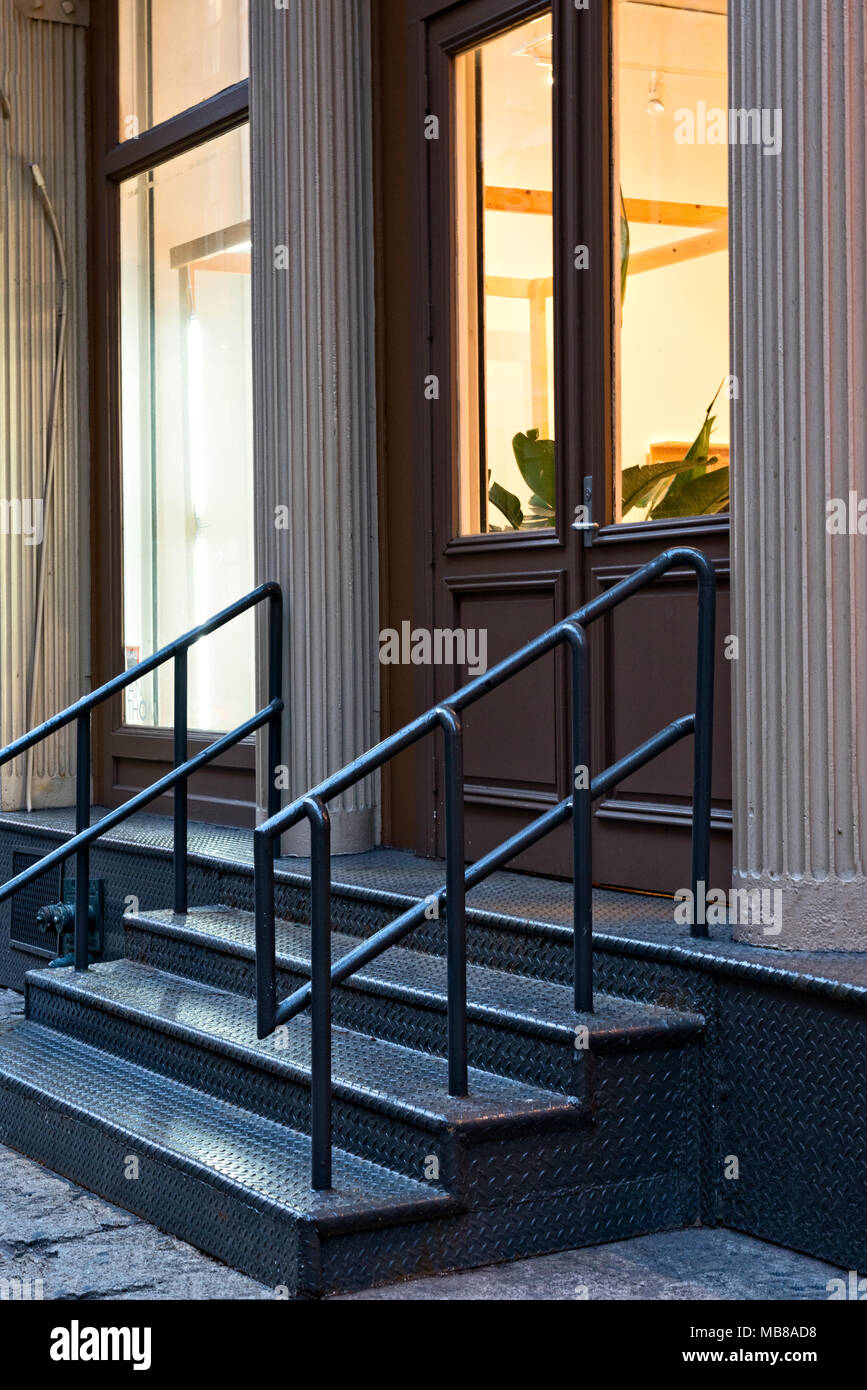 New York City, Manhattan, Soho.  Close Up of a Retail Store Entry in a Cast Iron Building. Stock Photo