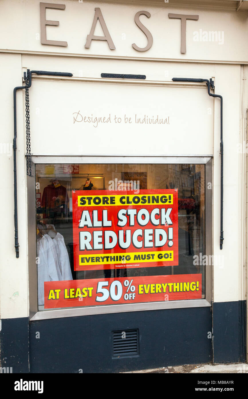 Women's high street fashion chain store East closing down sale due to going bankrupt with all stock reduced to 50% off in shop Stock Photo