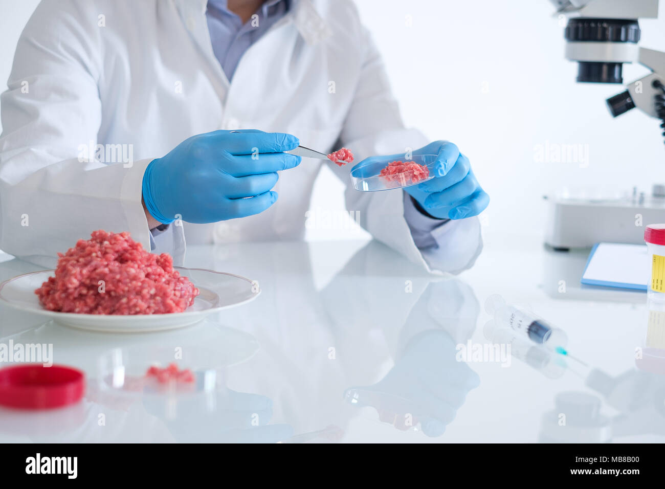 Fresh meat sample quality control in laboratory microscope Stock Photo
