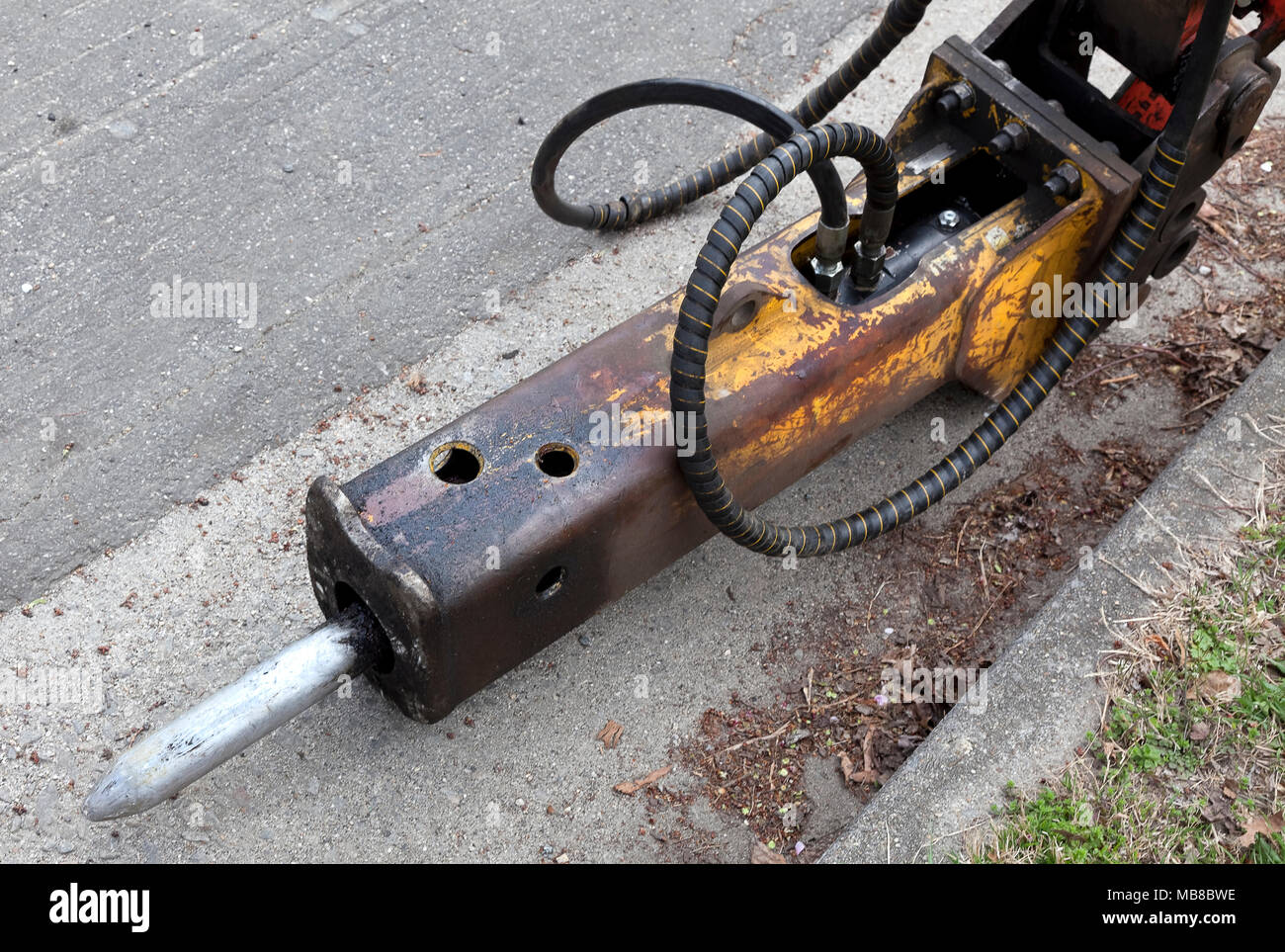 Detail of used, dirty, loud and efficient pneumatic hammer chisel. Stock Photo