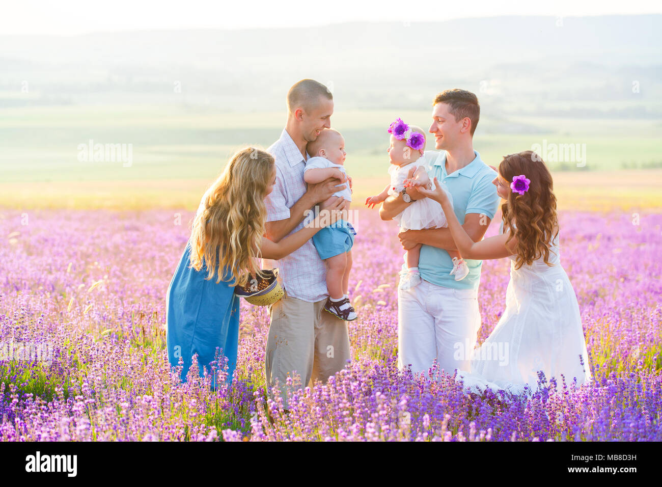 Two couples with their children have a rest in Provence. Beautiful young family with little boy and girl. Friends on vacation. Six people in the villa Stock Photo