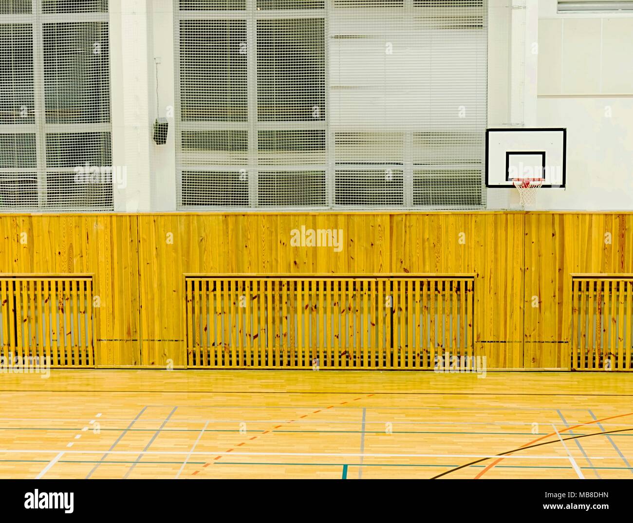 Basket ball hoop in empty basketball court, school sporting hall Stock