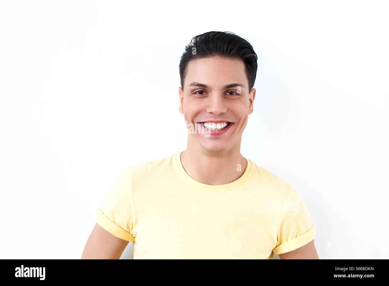 Portrait of happiness man toothy smiling and looking at camera. Emotions and feelings concept. Indoor shot, gray background Stock Photo