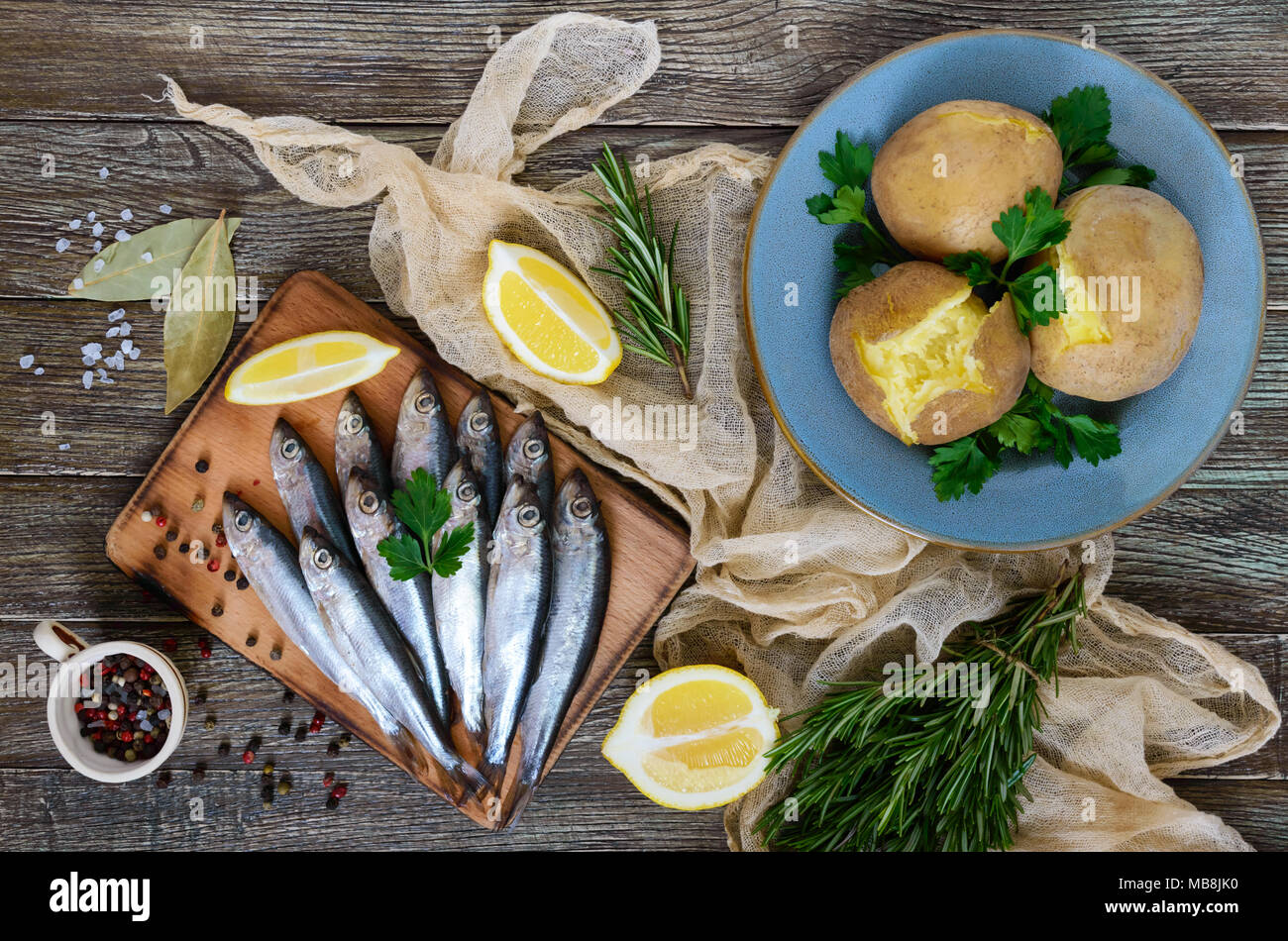 Boiled unpeeled potatoes in skins, a small salted fish of Baltic