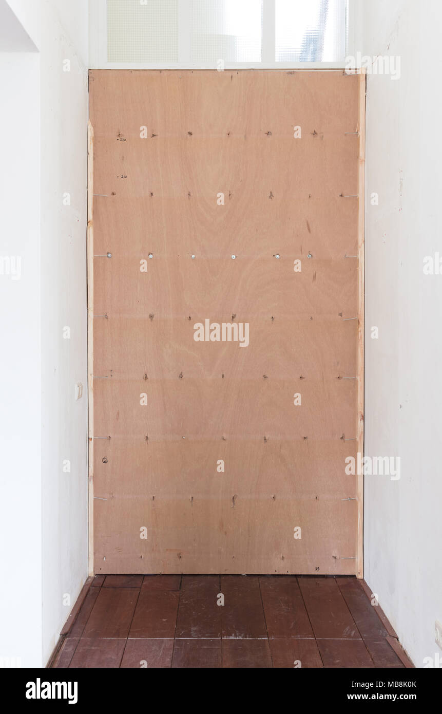Temporary plywood in front of a door Home improvement Stock Photo Alamy