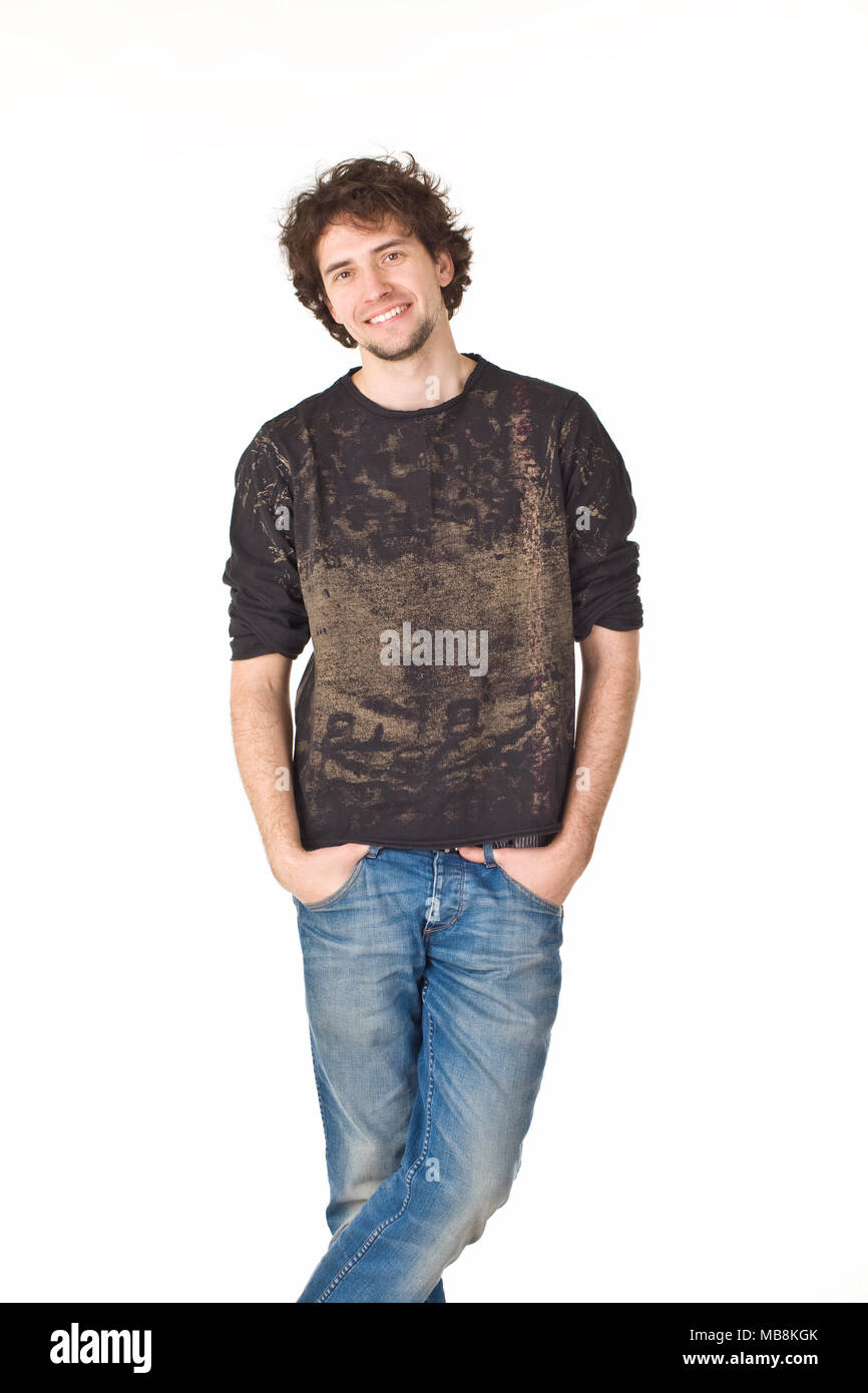 Nice smiling man pointing hands in pockets and posing to camera Stock Photo