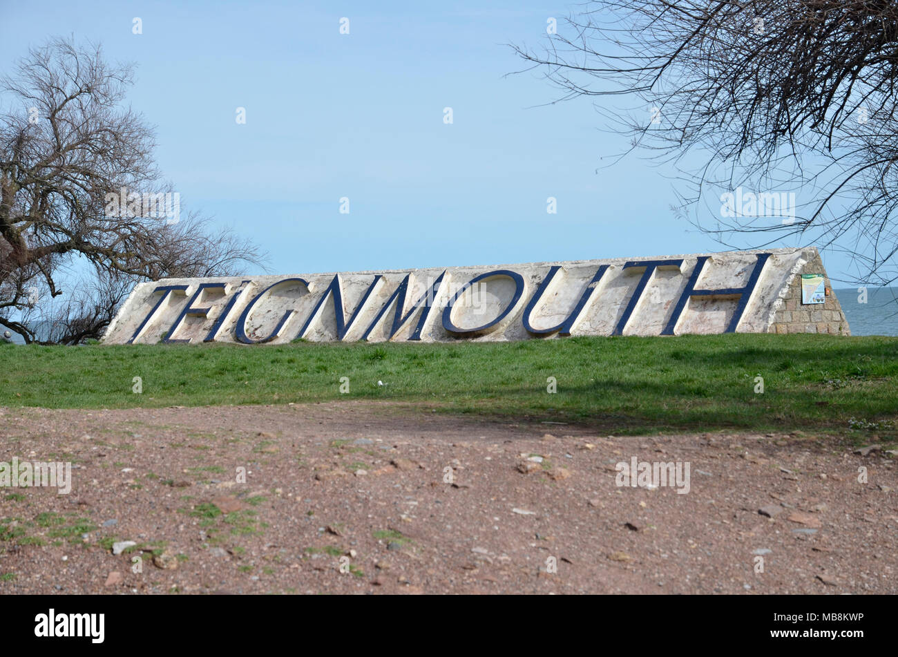 The town sign between the sea and the railway line at Teignmouth in Devon Stock Photo