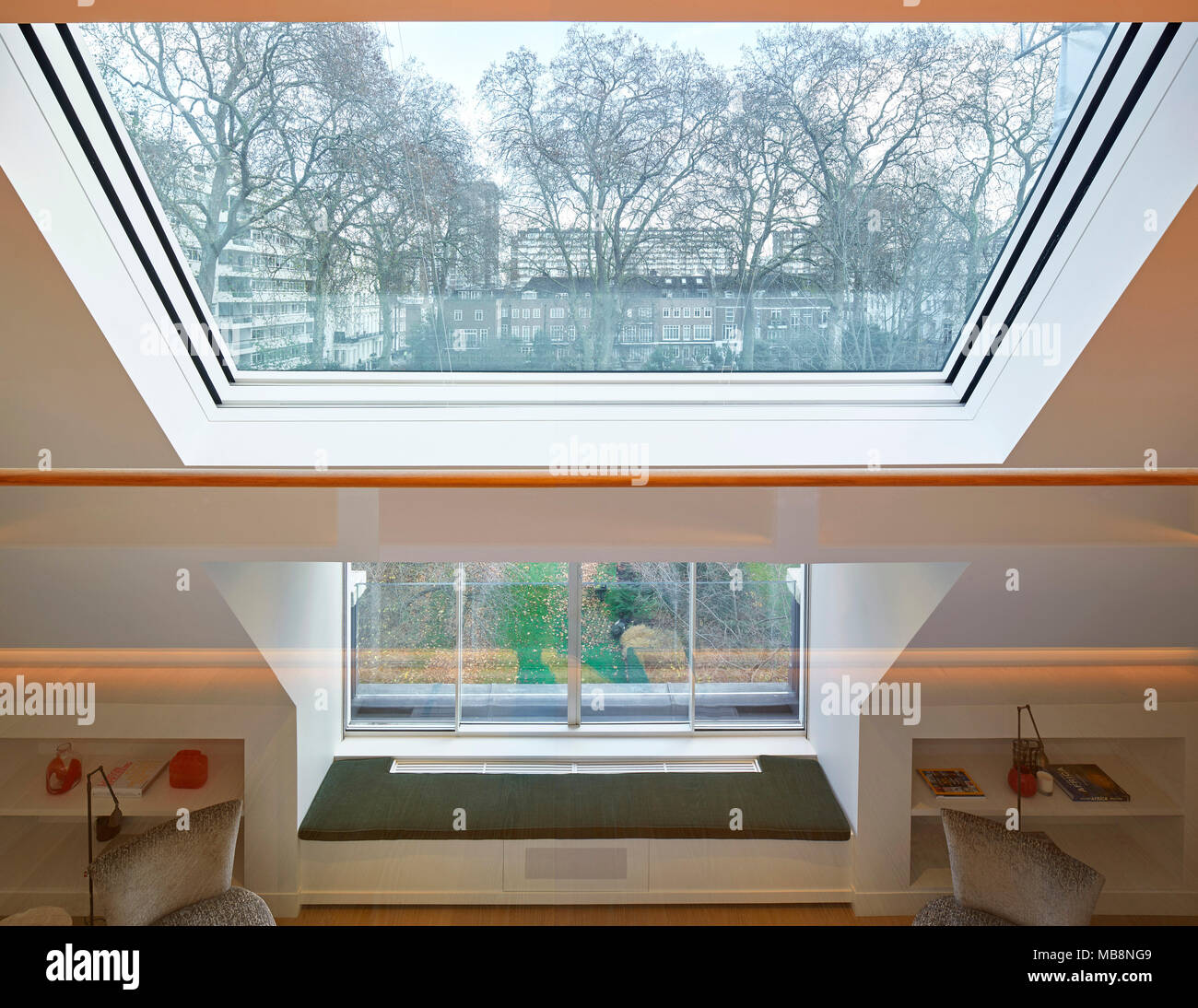 Double height space looking over communal gardens. Private residence ...